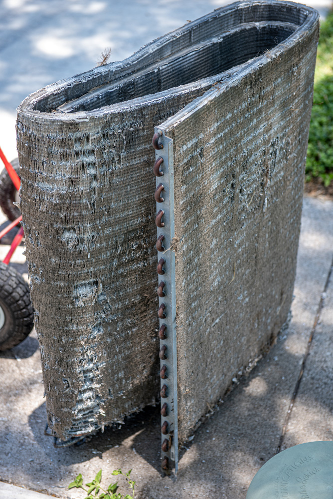 an image of an extremely dirty AC unit filter replaced after AC repairs at a residential home